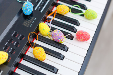 Easter decoration, colorful eggs on a piano
