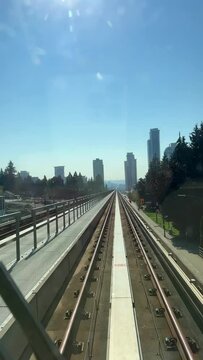 time-lapse vancouver skytrain The distance between two stops shooting in the windshield you can see the rails flickering as well as skyscrapers in the distance 09.2022 Canada