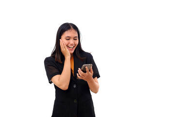 Surprised young asian business woman standing while getting a good news from her phone. Isolated