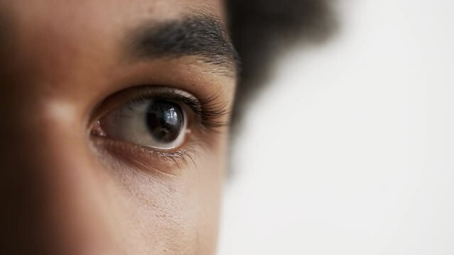 Closeup of African American man's eye, human race, DNA research, inheritance