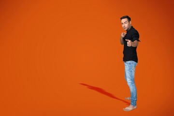 Smiling young man standing on background