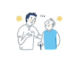 笑顔で話すシニア男性と介護スタッフ