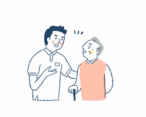 笑顔で話すシニア男性と介護スタッフ