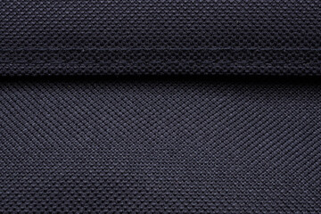 Black fabric texture pattern with stitch background