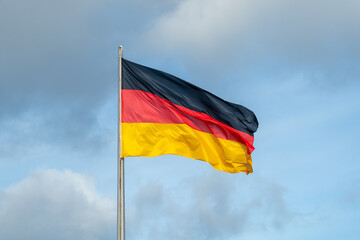 German Flag Berlin Germany Deutschland Flagge with Blue Sky
