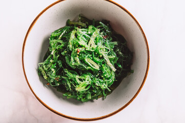 Seaweed Salad is Super Healthy and Nutritious Snack with sesame seeds, dietary supplement, superfood of the sea, Green Chuka or Algae