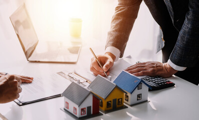 Real estate broker agent presenting and consult to customer to decision making sign insurance form...