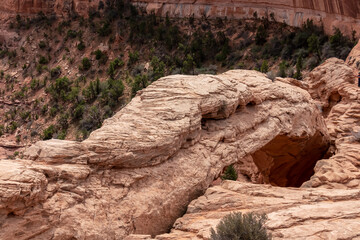 Obraz premium Top view of Mesa Arch near Moab, Canyonlands National Park, San Juan County, Southern Utah, USA. Looking at natural pothole arch rock formation on the eastern edge of Island in the Sky Mesa