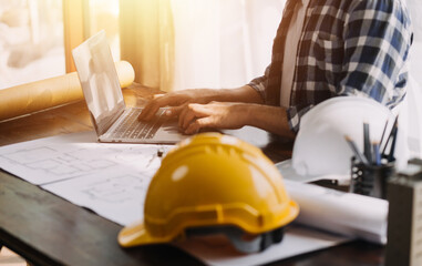 Construction and structure concept of Engineer or architect meeting for project working with partner and engineering tools on model building and blueprint in working site, contract for both companies.