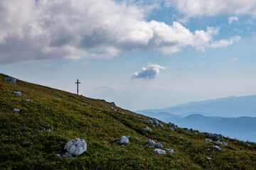 Fototapeta premium Cross up in the Alps mountains