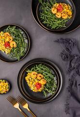 Food photography of salad, salsa, mango, avocado, shrimp, prawn, arugula, rocket, vegetable; onion; sauce, chili