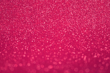 Abstract Glitter Background. Magenta Colored Texture Sparkling Shiny Paper for Christmas Holiday. Seasonal Wallpaper Decoration. Greeting, Wedding Invitation Card Design. Sparkle Light Bokeh Backdrop