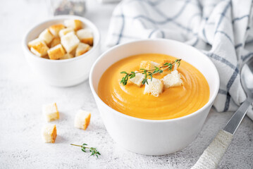 Sweet potato soup with croutons and thyme leaves
