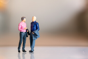 Miniature people , Gay Couple standing together and copy space for text
