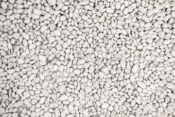 White pebble stone texture on the ground.