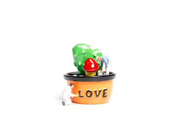 Painters coloring plant in a pod with love word , Valentine's Day concept