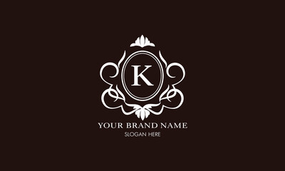 Vector illustration of letter K logo template. Classic floral monogram with decorative elements.