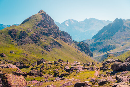 Traveler walking on path in mountains