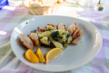 Seafood: Squids stuffed with shrimps served with potatoes served in Sutomore, Montenegro