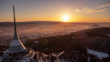A bird's eye view of snow-covered Jested at sunrise. Photographed on the Jested ridge by drone....