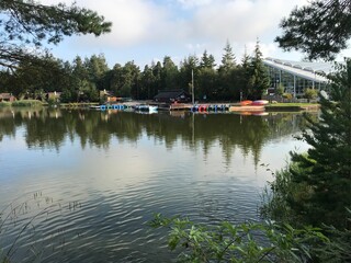 Fototapeta na wymiar Boating lake and water sport center at Center Parcs in Whinfell forest