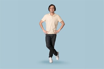 Carefree young man posing on background