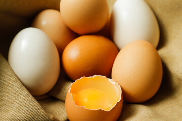 fresh open egg on sackcloth, free-range eggs