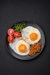 Delicious hearty breakfast consisting of two fried eggs, canned lentils and microgreens