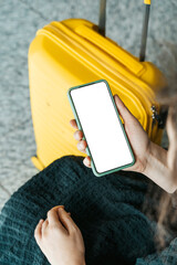 Using phone in travelling. Blank screen smartphone at the airport before the flight. Application...