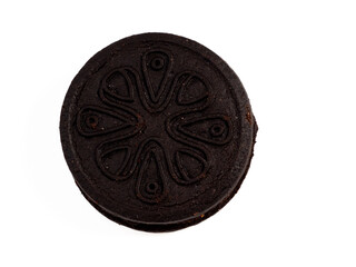 Black tasty cookies isolated on white background. Close-up.