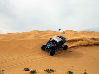 Fototapeta na wymiar Canam UTV side by side off-roading in Glamis Desert