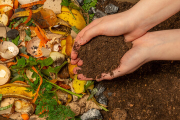 organic compost - biodegradable kitchen waste and soil. Layers of biowaste is covering with soil