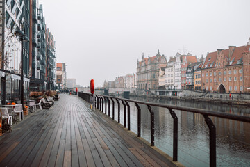Fototapeta premium Beautiful Gdansk over the Motlawa river at fog. Poland. High quality FullHD footage