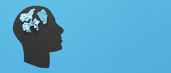 Human head and crumpled paper on blue background with space for text. Concept of neurology