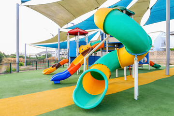 View of children's playground with slides in city