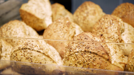 Fresh Baked Healthy Whole Bread Rolls Pastry with Sesame and Linseed. Shopping at the grocery store. Selling food concept.