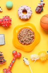Composition with pet care accessories and bowl of wet food on color background