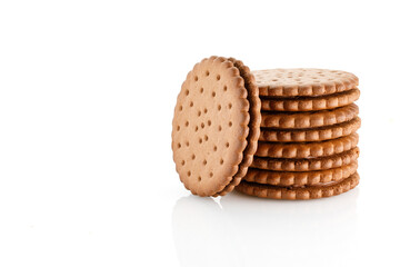 Double chocolate chip cookie. Tasty chocolate sandwich cookies with choco cream, isolated on white background. Close-up