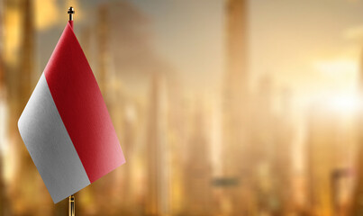 Small flags of the Indonesia on an abstract blurry background