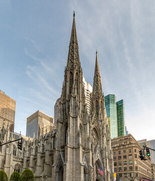 New York, USA - April 23, 2022: View of the St. Patricks Cathedral in Midtown Manhattan with the famous 5th Avenue. Its a decorated Neo-Gothic-style Roman Catholic cathedral church