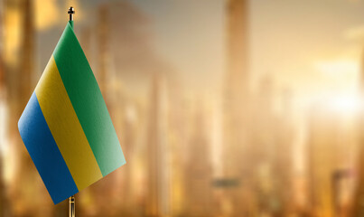 Small flags of the Gabon on an abstract blurry background