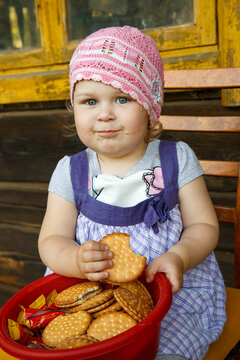A little girl poses in front of the camera.