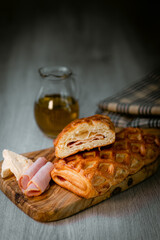 Bakery shop products - various kinds of baguette, bagel, donut, croissant, rolls, bread, puff pastry, powdered sugar delicious pies. Neutral background. Food from bakeries.