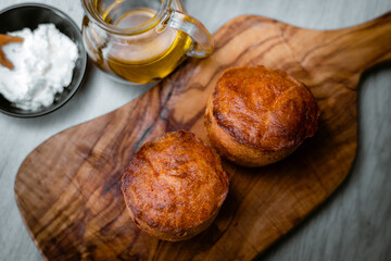 Bakery shop products - various kinds of baguette, bagel, donut, croissant, rolls, bread, puff pastry, powdered sugar delicious pies. Neutral background. Food from bakeries.