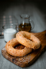 Bakery shop products - various kinds of baguette, bagel, donut, croissant, rolls, bread, puff pastry, powdered sugar delicious pies. Neutral background. Food from bakeries.