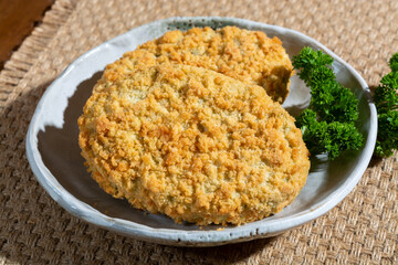 Uncooked fresh vegan and vegetarian burgers made from fresh vegetables and dried legumes and beans, ready to barbecue grill