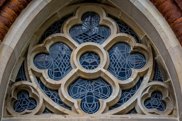 Gothic rose window of St. Johann church in Bremen Schnoorviertel with an all-seeing eye at its...