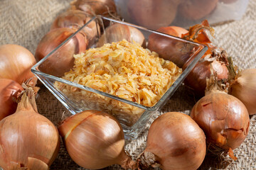 Dried yellow frakes of onion, asian cuisine, close up