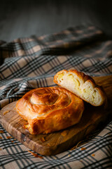 Bakery shop products - various kinds of baguette, bagel, donut, croissant, rolls, bread, puff pastry, powdered sugar delicious pies. Neutral background. Food from bakeries.