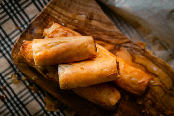 Bakery shop products - various kinds of baguette, bagel, donut, croissant, rolls, bread, puff pastry, powdered sugar delicious pies. Neutral background. Food from bakeries.